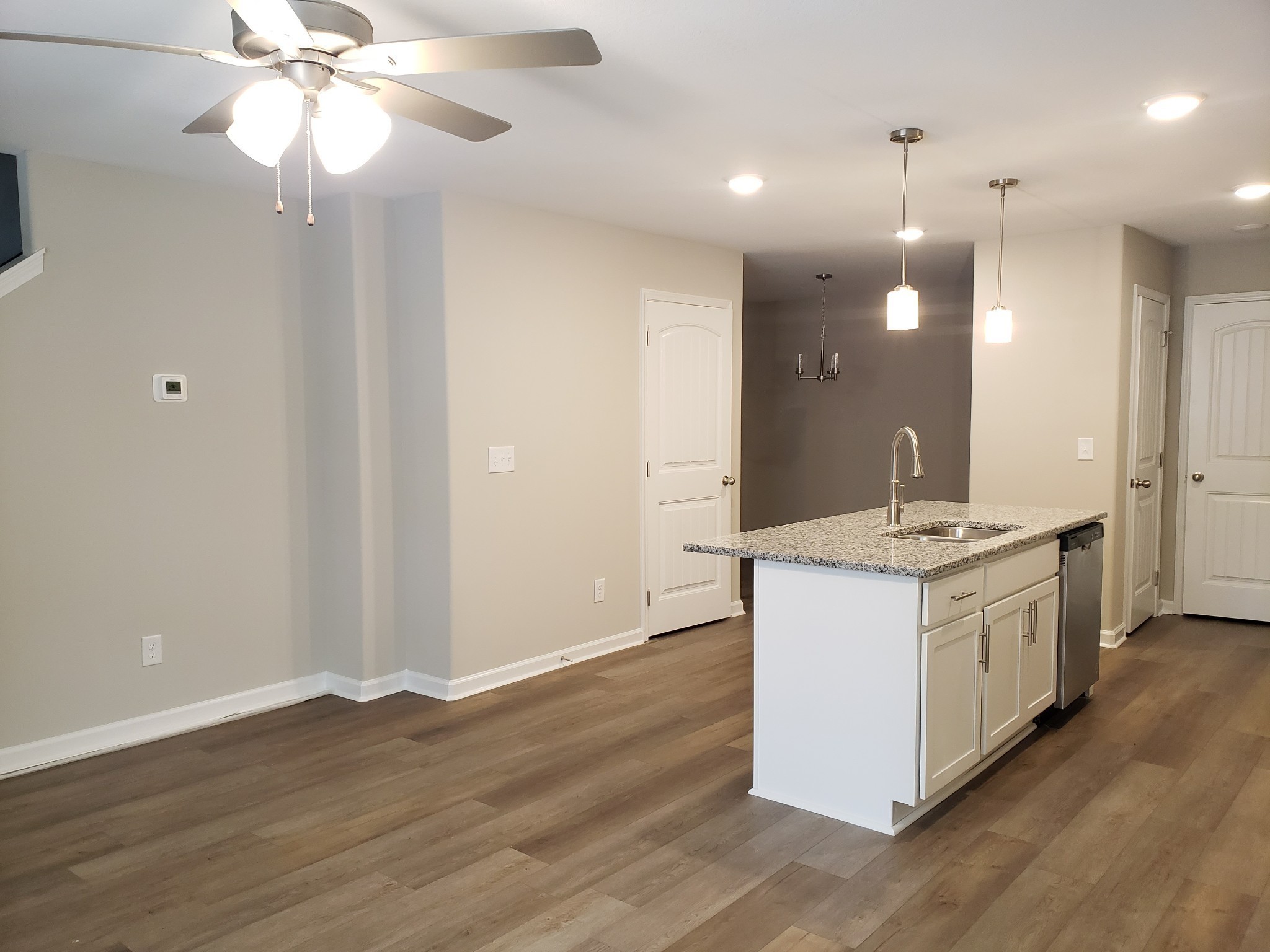 610 Commerce Street, Unit 24 Clarksville, TN 37040 - Photo 3 of 18 a kitchen with a sink and chandelier