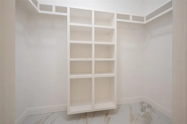 a view of an empty room with empty racks