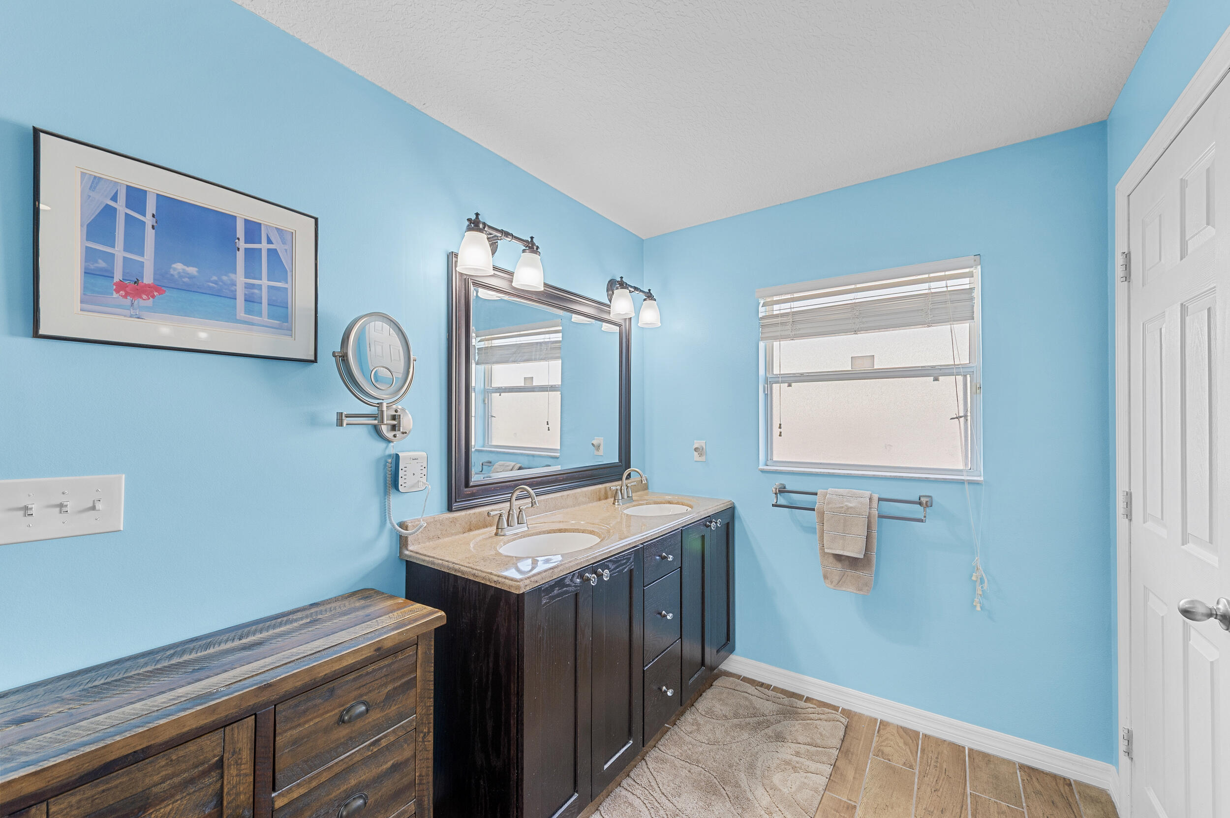 4164 Southwest Spickler Street Port St. Lucie, FL 34953 - Photo 20 of 35 a room with cabinets and mirror