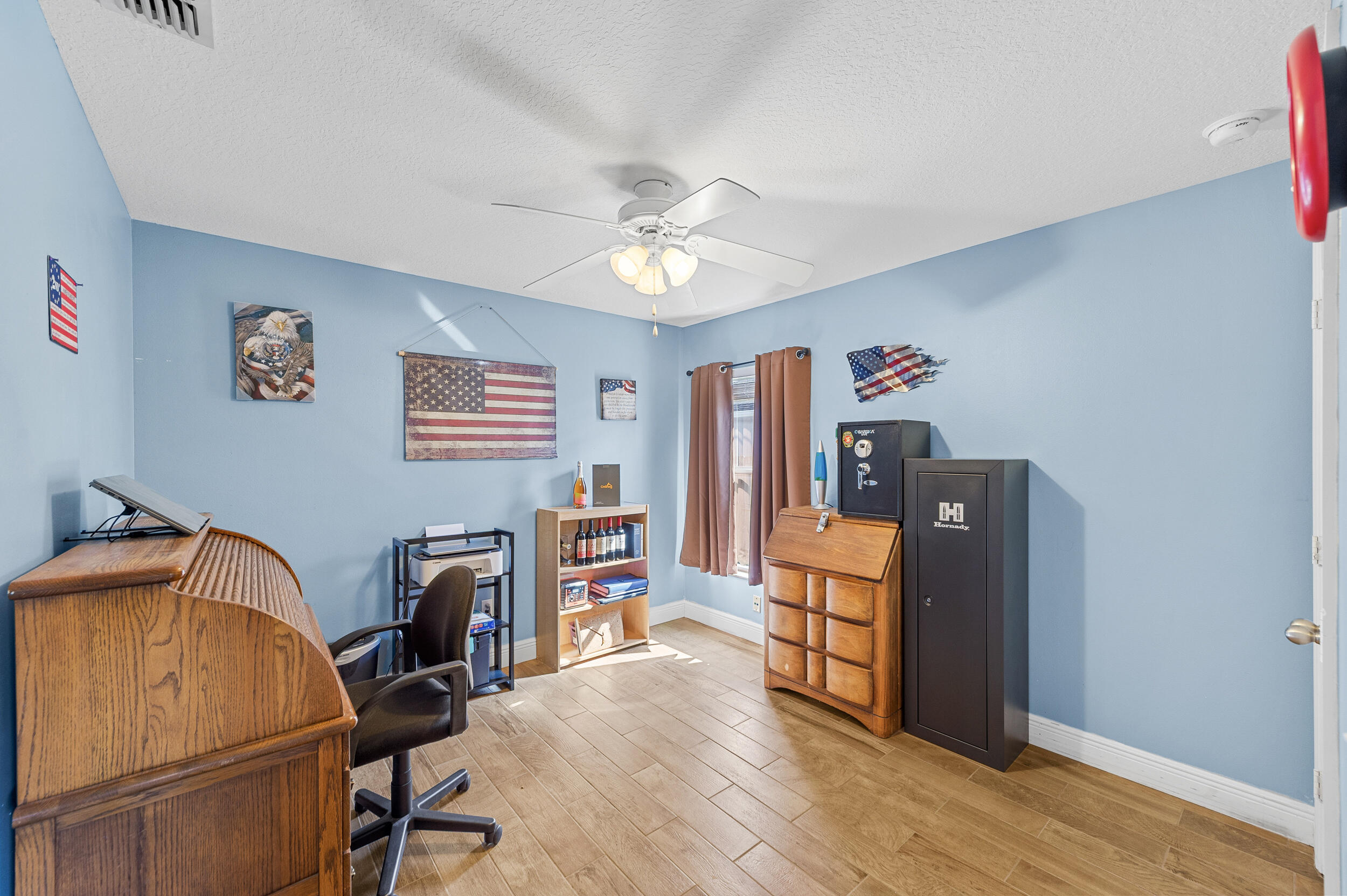 4164 Southwest Spickler Street Port St. Lucie, FL 34953 - Photo 23 of 35 a view of a workspace with furniture and cabinet