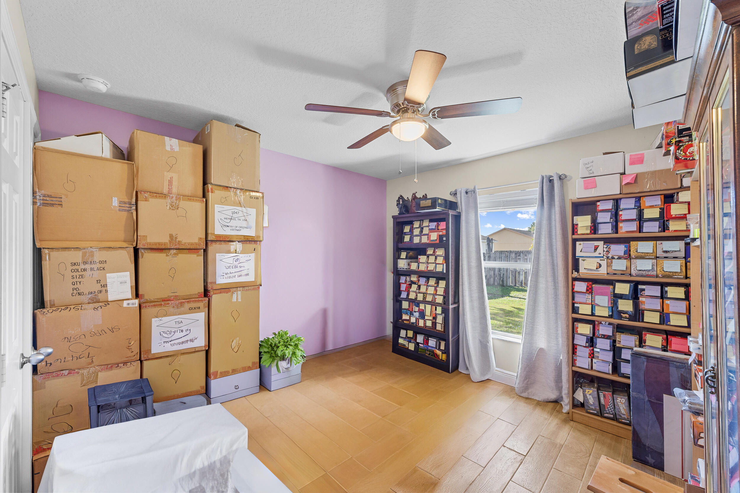 4164 Southwest Spickler Street Port St. Lucie, FL 34953 - Photo 26 of 35 a bedroom with furniture and a book shelf