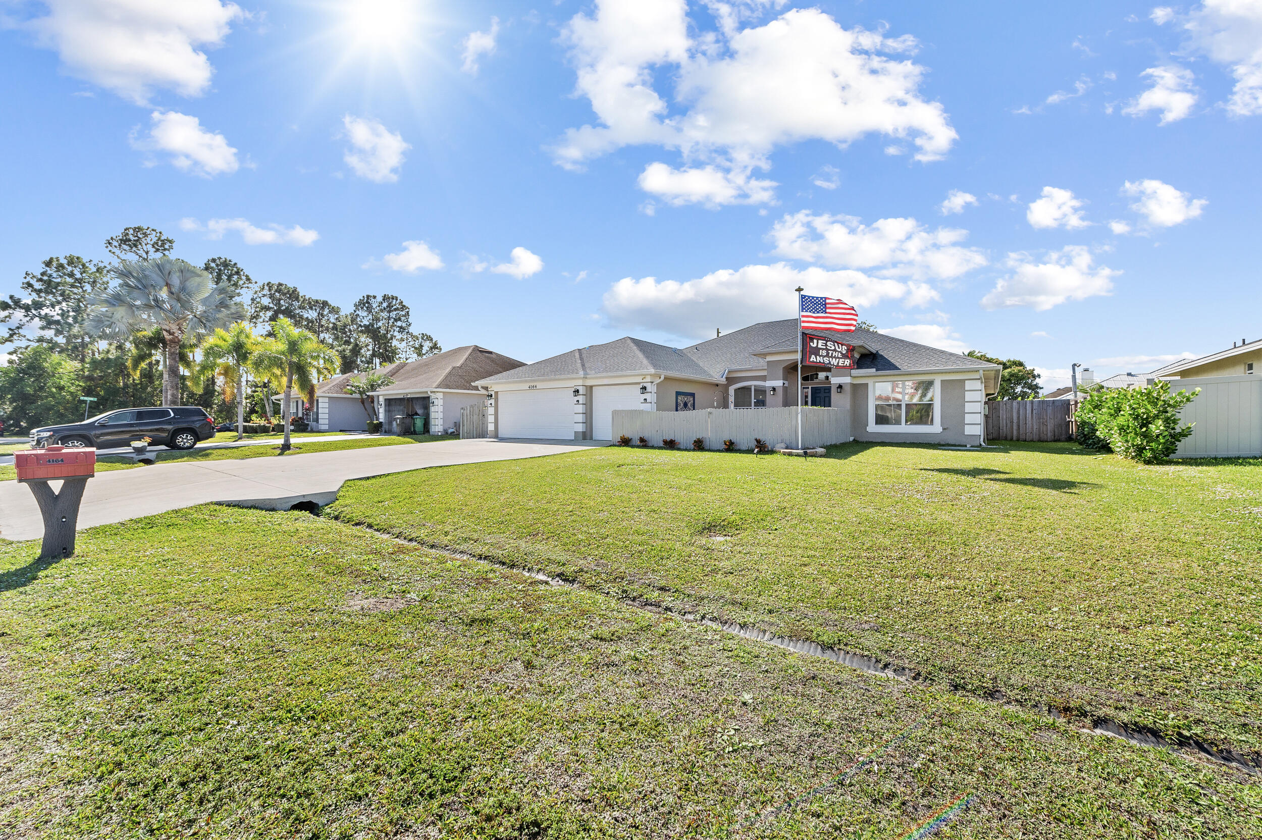 4164 Southwest Spickler Street Port St. Lucie, FL 34953 - Photo 3 of 35 a view of a house with a yard