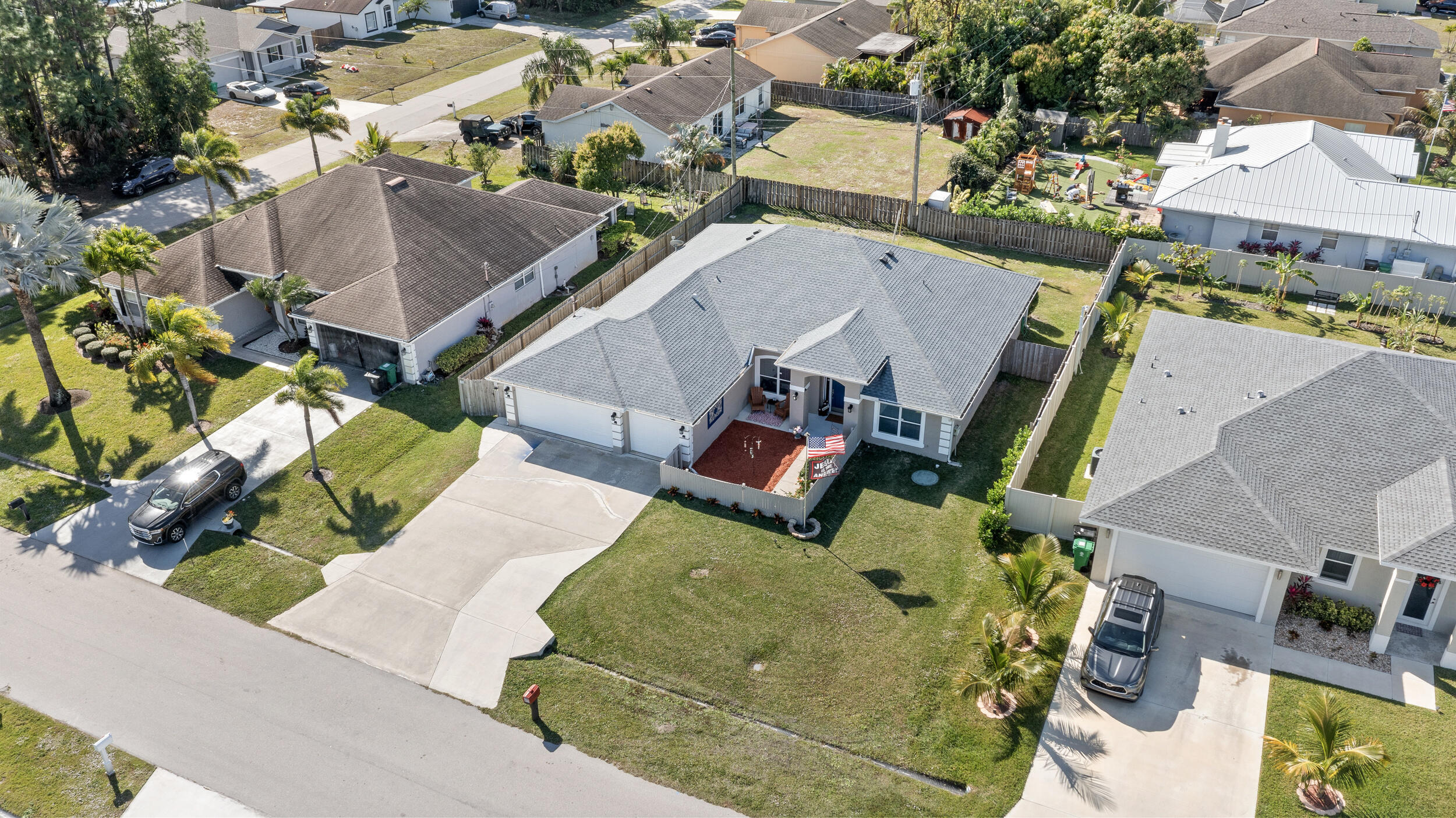 4164 Southwest Spickler Street Port St. Lucie, FL 34953 - Photo 5 of 35 an aerial view of residential houses with outdoor space