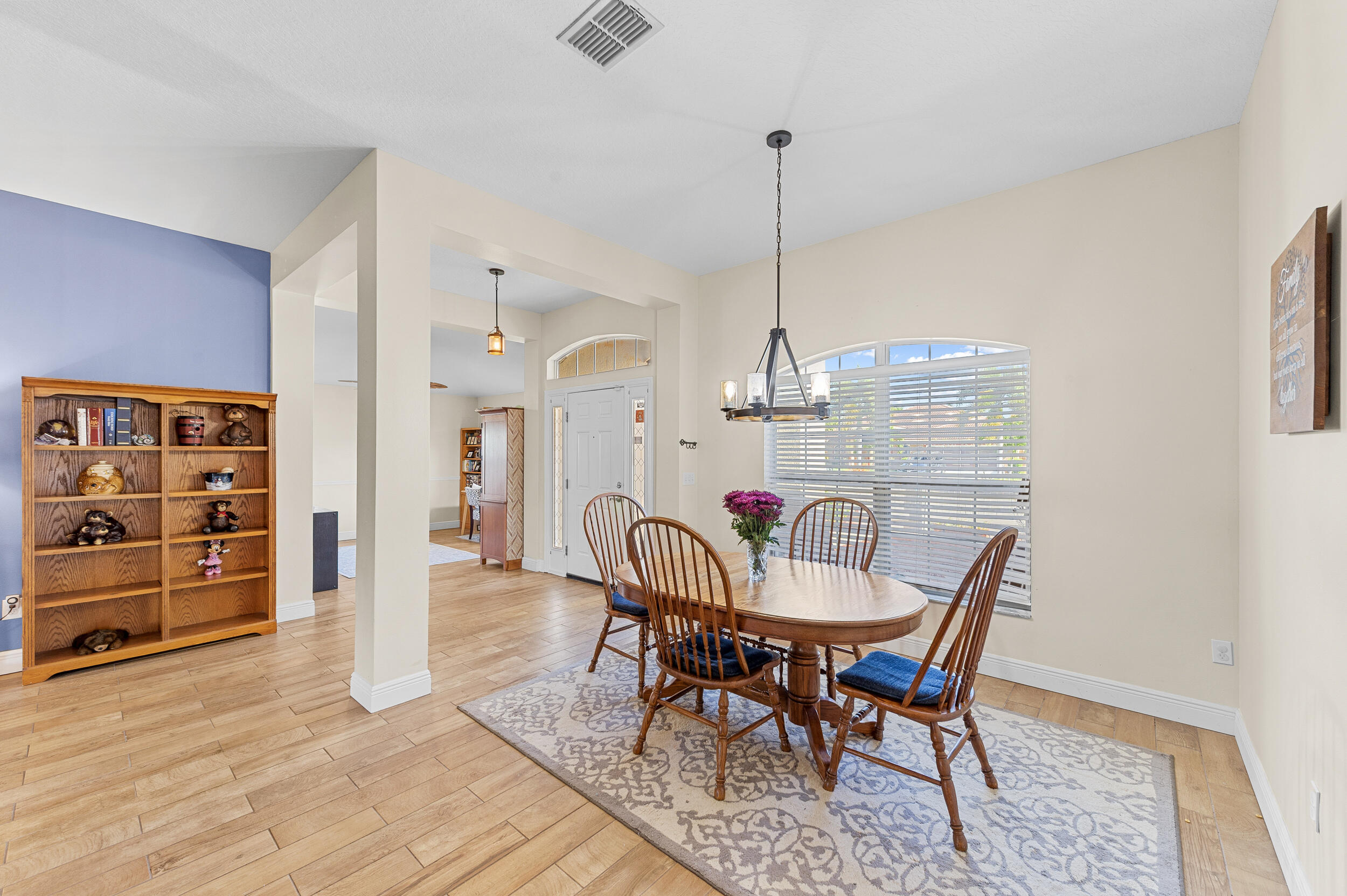 4164 Southwest Spickler Street Port St. Lucie, FL 34953 - Photo 9 of 35 a view of a dining room with furniture