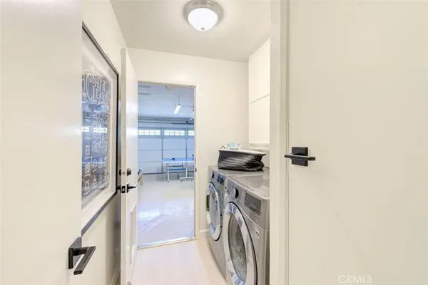 a kitchen with a refrigerator and a stove