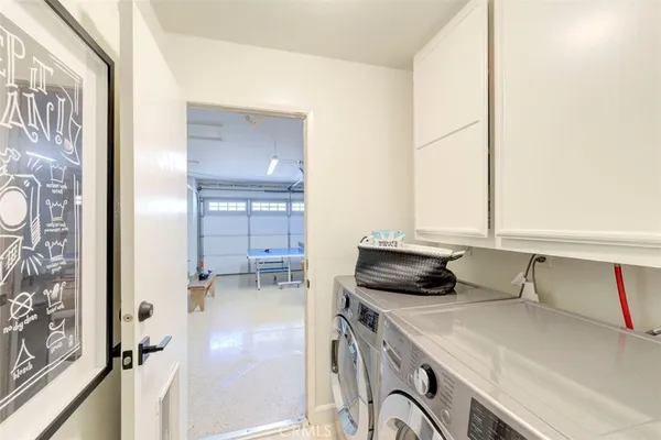 a living room with furniture a flat screen tv and a large window