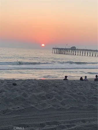 a room with a table chairs and a chandelier