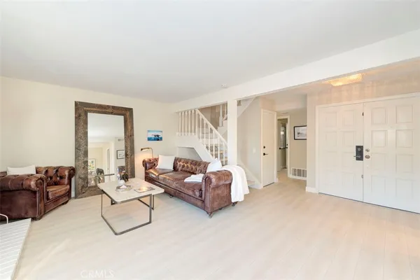 a living room with furniture white walls and white walls