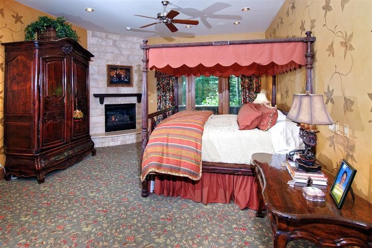 59 Borders Road Beaver Creek, CO 81620 - Photo 11 of 25 a bedroom with furniture and a fireplace