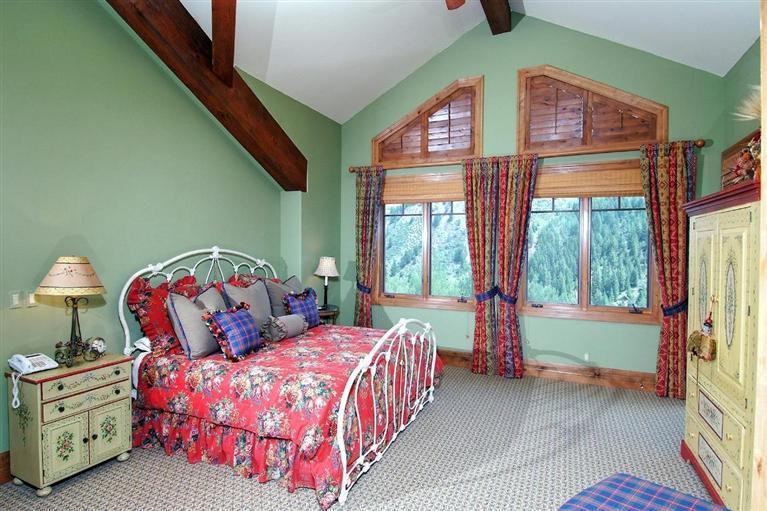 59 Borders Road Beaver Creek, CO 81620 - Photo 13 of 25 a bedroom with a bed and a large window