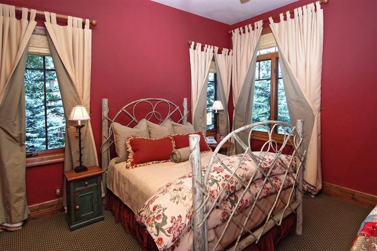 59 Borders Road Beaver Creek, CO 81620 - Photo 16 of 25 a bedroom with a bed and wooden floor