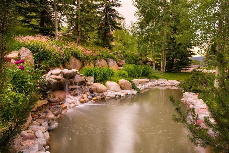 59 Borders Road Beaver Creek, CO 81620 - Photo 20 of 25 a backyard of a house with a yard and outdoor seating
