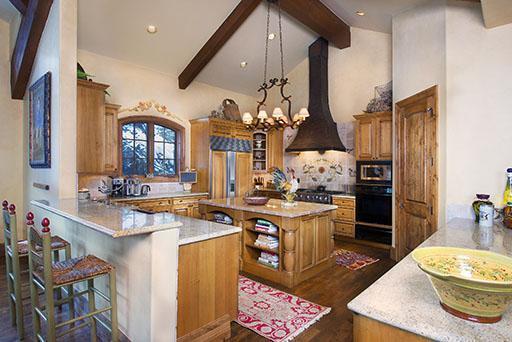 59 Borders Road Beaver Creek, CO 81620 - Photo 5 of 25 a kitchen with stainless steel appliances granite countertop a stove and a dining table