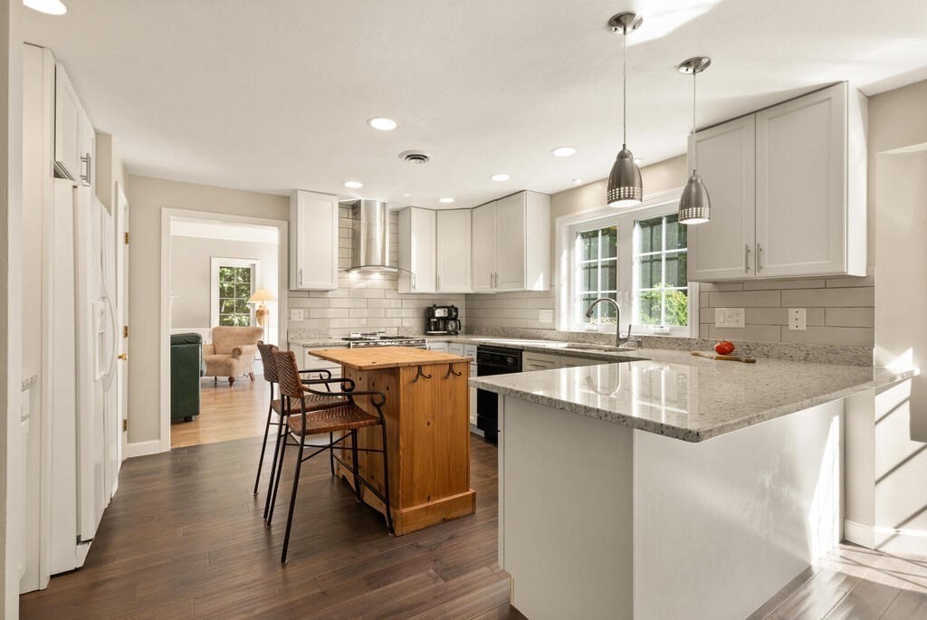 17 Azalea Road Sharon, MA 02067 - Photo 15 of 35 a kitchen with stainless steel appliances granite countertop a sink a stove a refrigerator and wooden floor