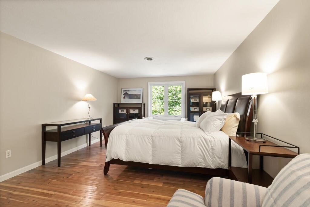 17 Azalea Road Sharon, MA 02067 - Photo 20 of 35 a bedroom with a bed and a lamp