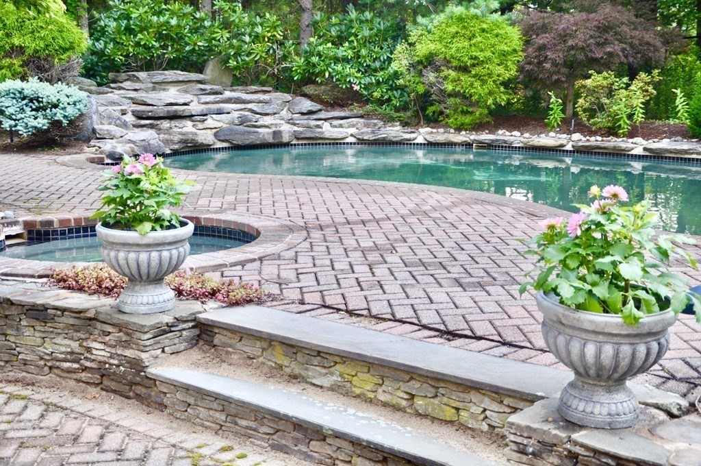 17 Azalea Road Sharon, MA 02067 - Photo 30 of 35 a view of a backyard with chair and potted plants