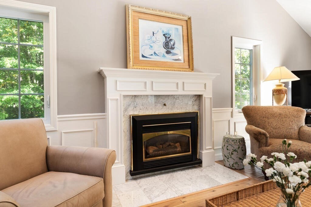 17 Azalea Road Sharon, MA 02067 - Photo 9 of 35 a living room with furniture a window and a fireplace