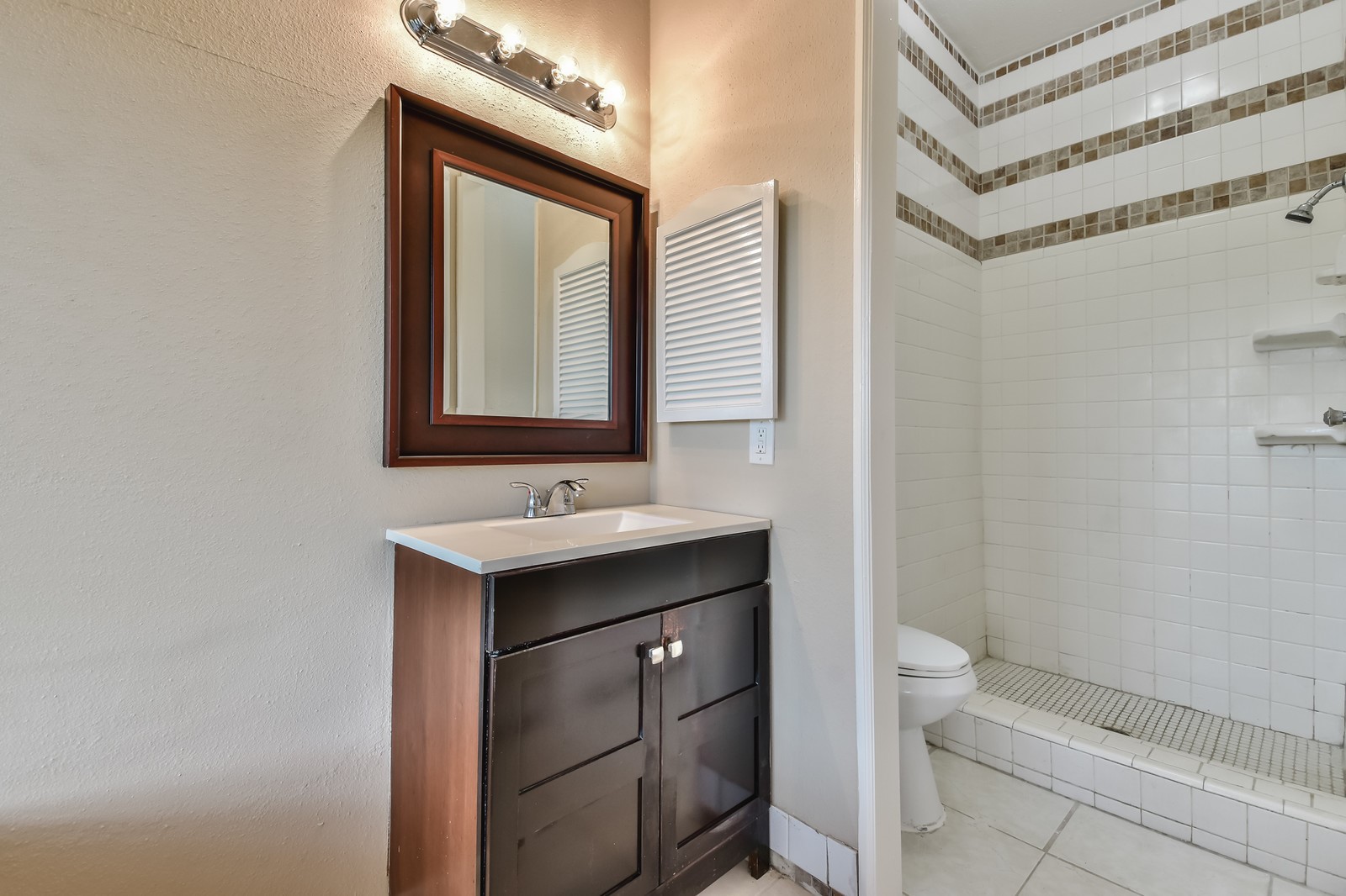 9503 Bent Spur Lane Houston, TX 77064 - Photo 17 of 28 a bathroom with a sink a toilet and mirror