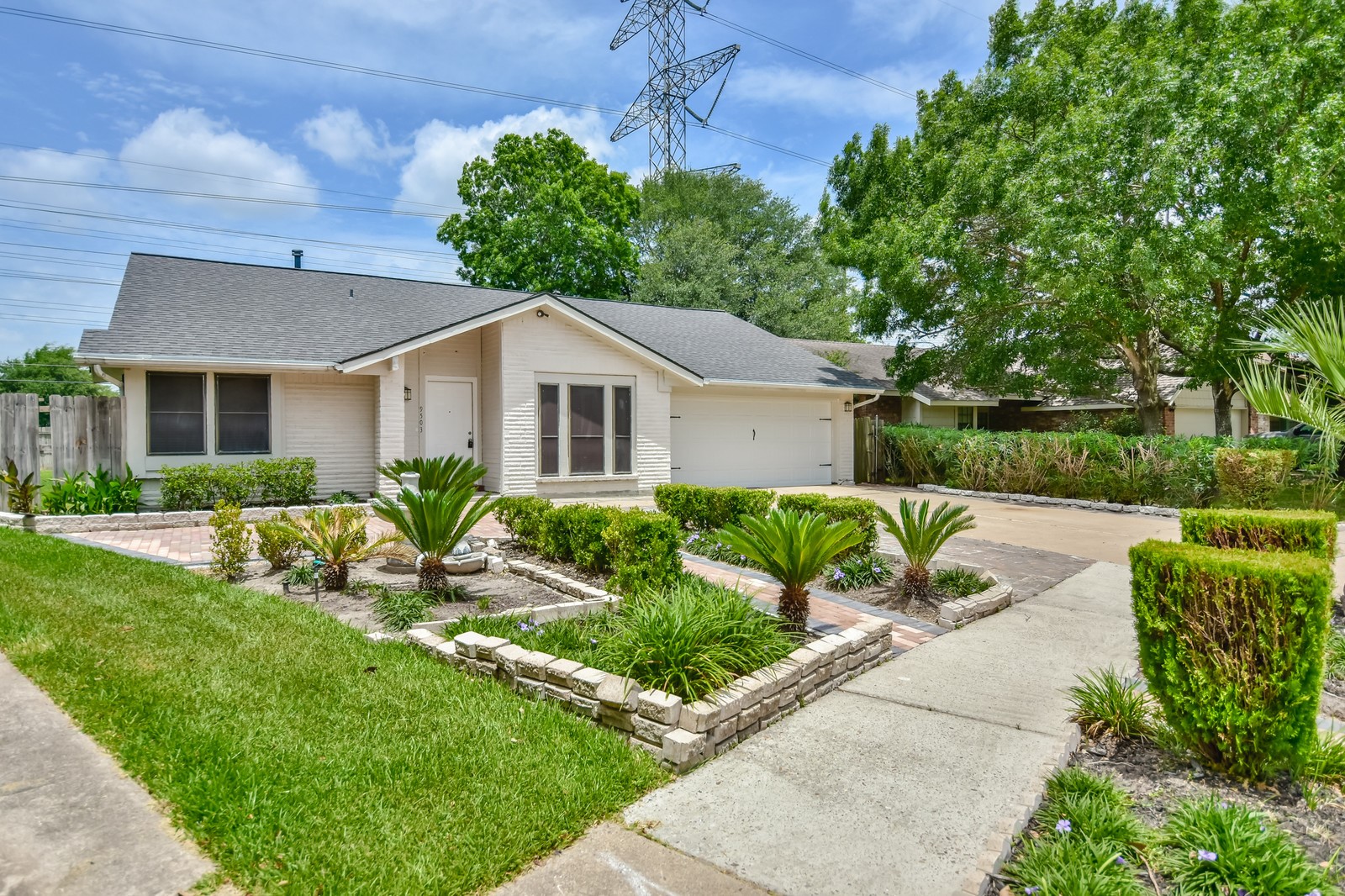 9503 Bent Spur Lane Houston, TX 77064 - Photo 2 of 28 a front view of a house with a yard