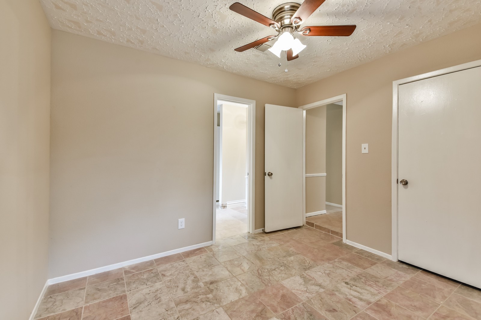 9503 Bent Spur Lane Houston, TX 77064 - Photo 25 of 28 a view of an empty room and chandelier fan
