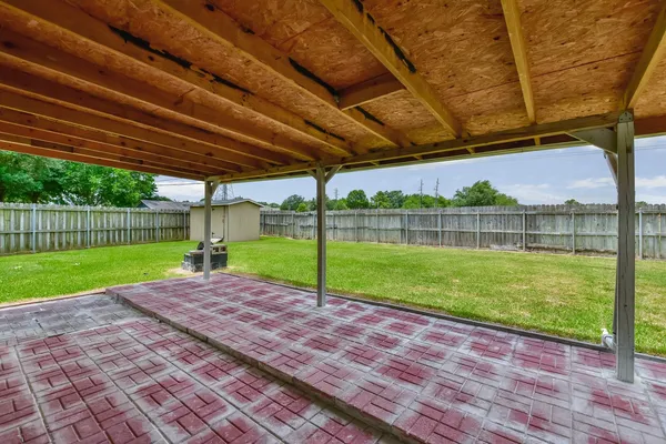 a view of a backyard with wooden floor