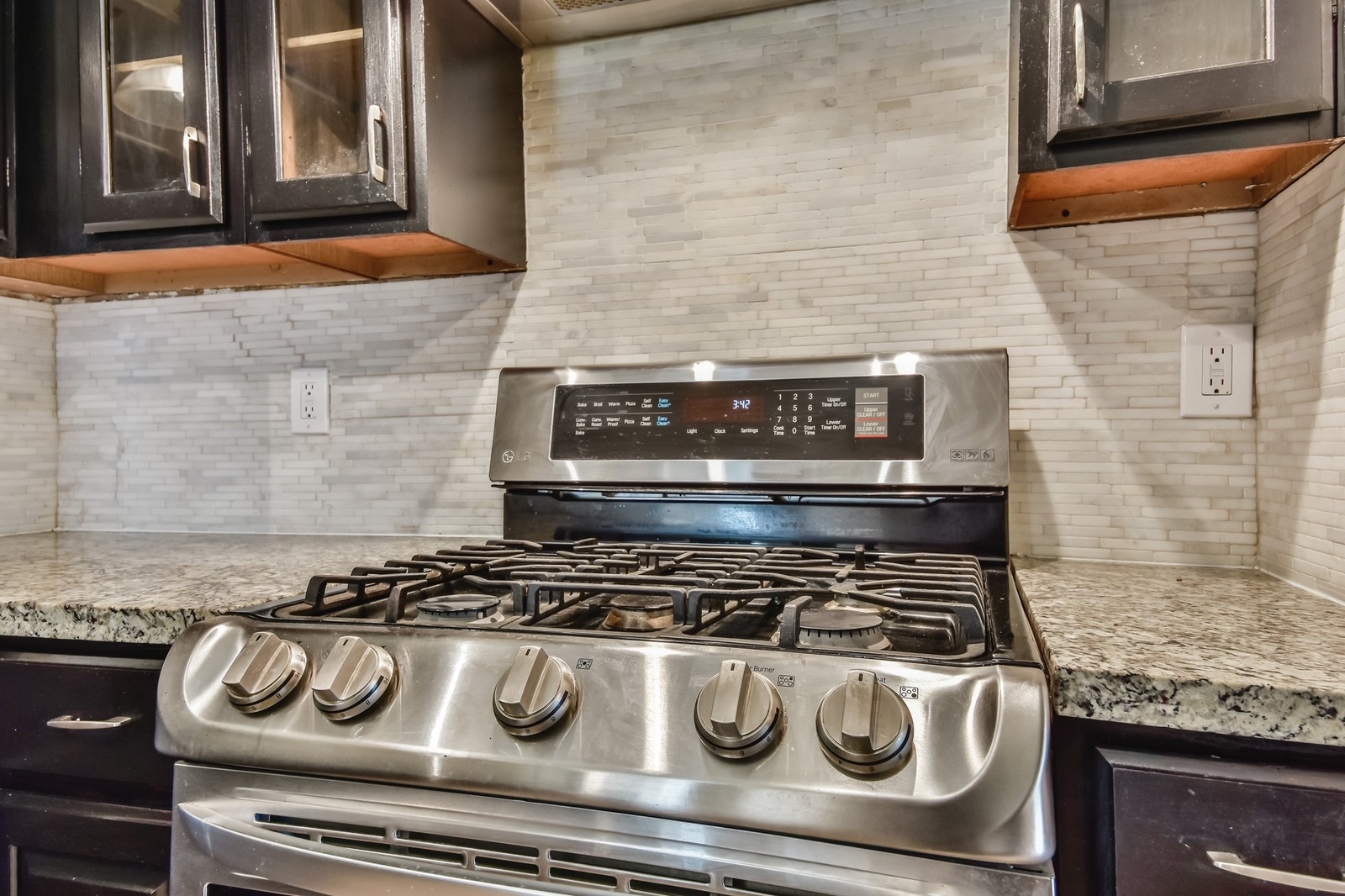 9503 Bent Spur Lane Houston, TX 77064 - Photo 10 of 28 a stove top oven sitting inside of a kitchen