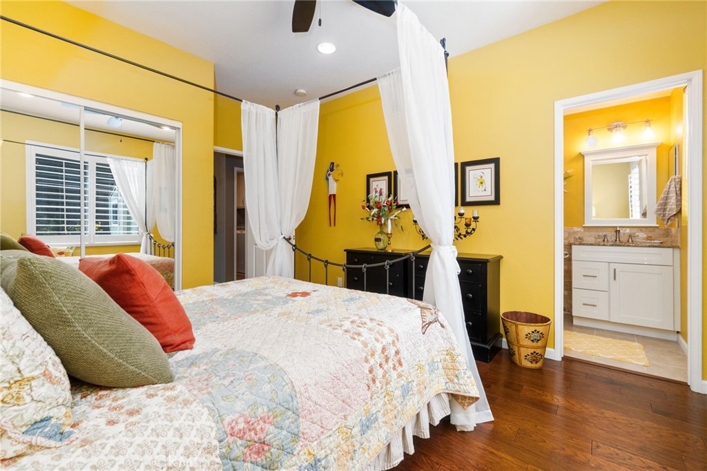 13939 Guidera Drive Rancho Cucamonga, CA 91739 - Photo 16 of 46 a bedroom with a bed and wooden floor