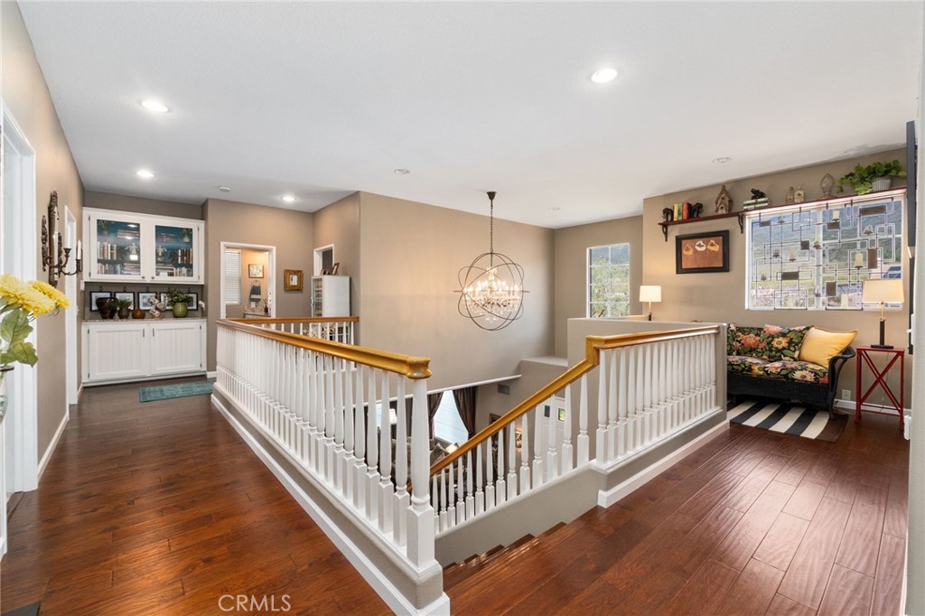 13939 Guidera Drive Rancho Cucamonga, CA 91739 - Photo 21 of 46 a view of a kitchen with furniture and wooden floor