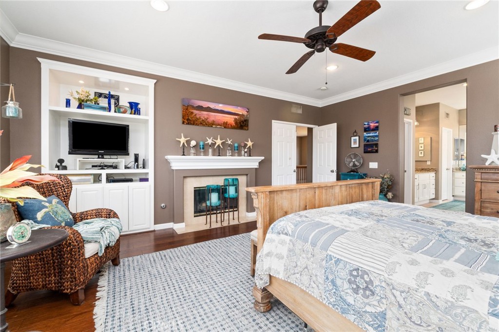 13939 Guidera Drive Rancho Cucamonga, CA 91739 - Photo 24 of 46 a spacious bedroom with a bed and a flat screen tv