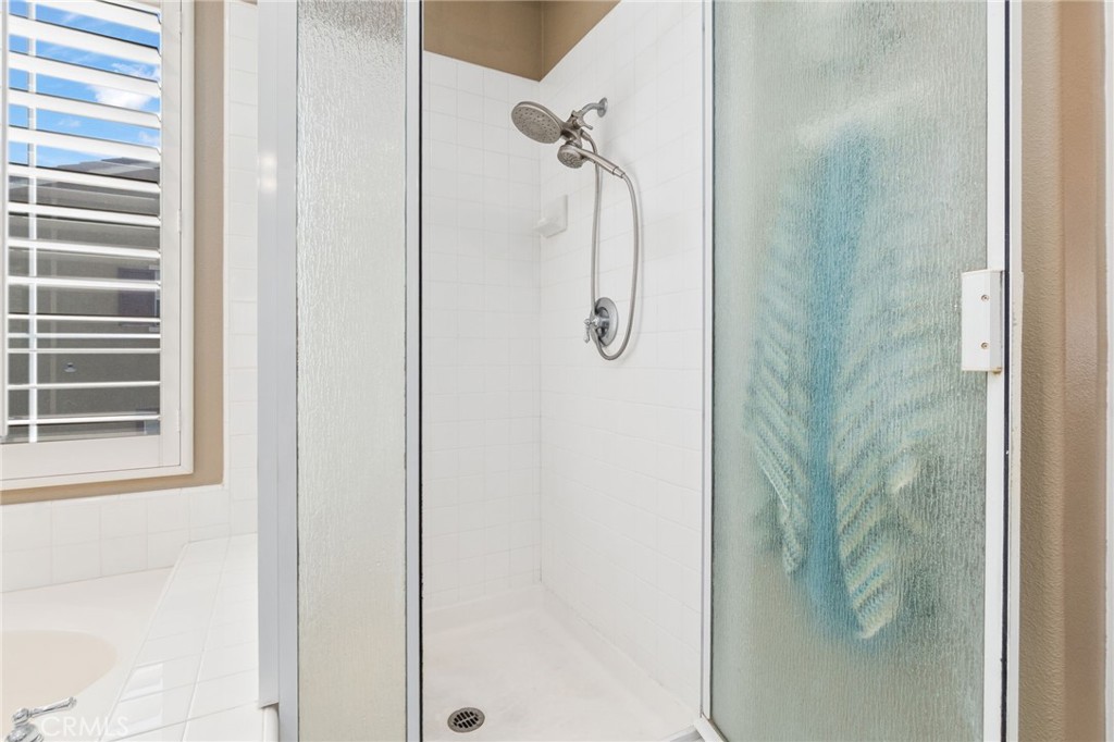 13939 Guidera Drive Rancho Cucamonga, CA 91739 - Photo 27 of 46 a bathroom with a shower