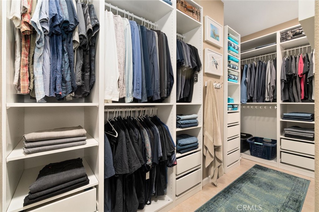 13939 Guidera Drive Rancho Cucamonga, CA 91739 - Photo 28 of 46 a view of walk in closet with clothes and shoes