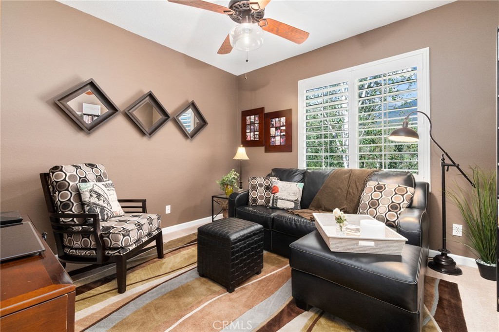 13939 Guidera Drive Rancho Cucamonga, CA 91739 - Photo 30 of 46 a living room with furniture and a large window