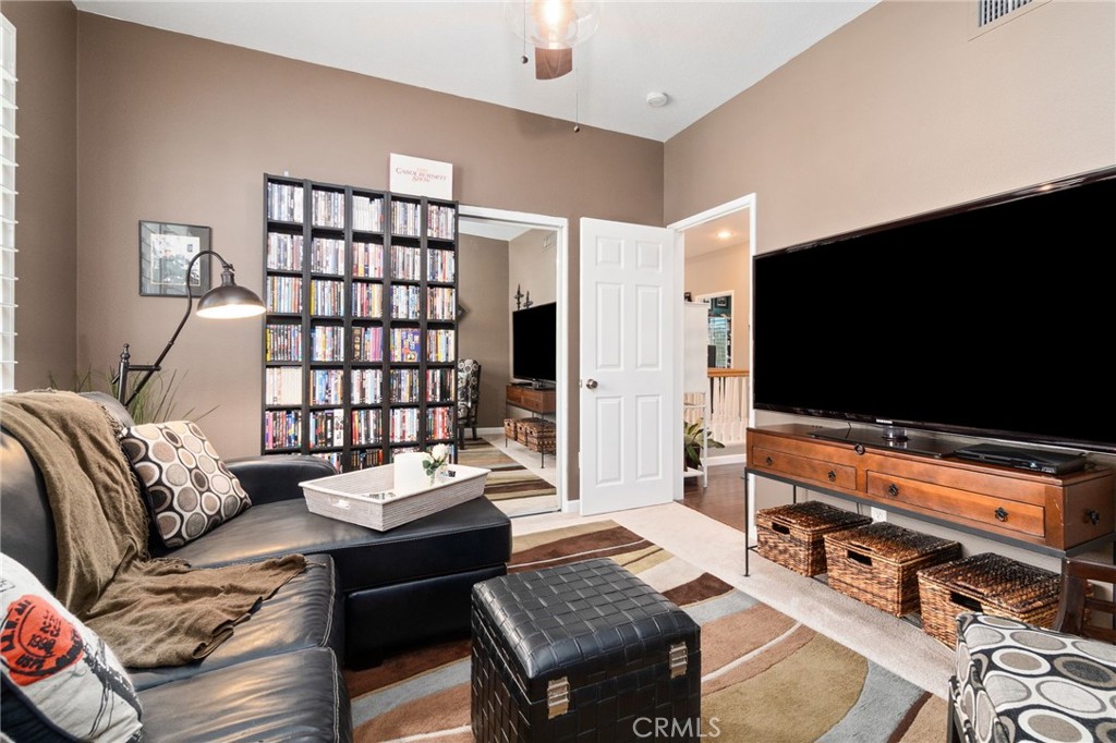 13939 Guidera Drive Rancho Cucamonga, CA 91739 - Photo 31 of 46 a living room with furniture and a flat screen tv