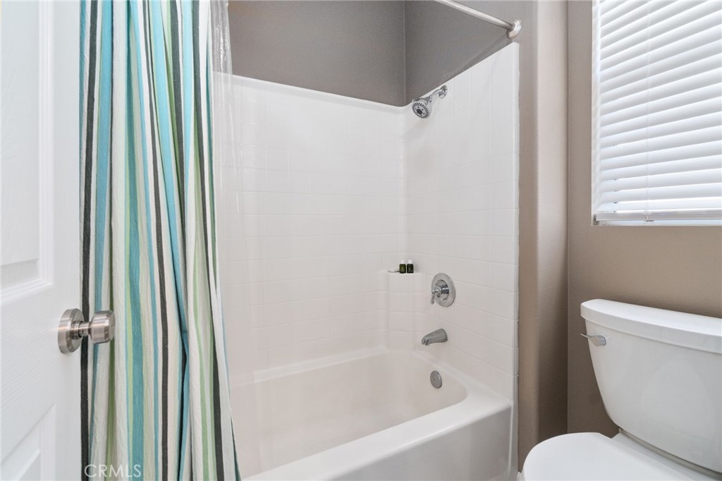 13939 Guidera Drive Rancho Cucamonga, CA 91739 - Photo 35 of 46 a bathroom with a toilet and a bathtub