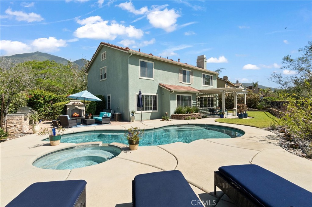 13939 Guidera Drive Rancho Cucamonga, CA 91739 - Photo 39 of 46 a front view of a house with swimming pool having outdoor seating