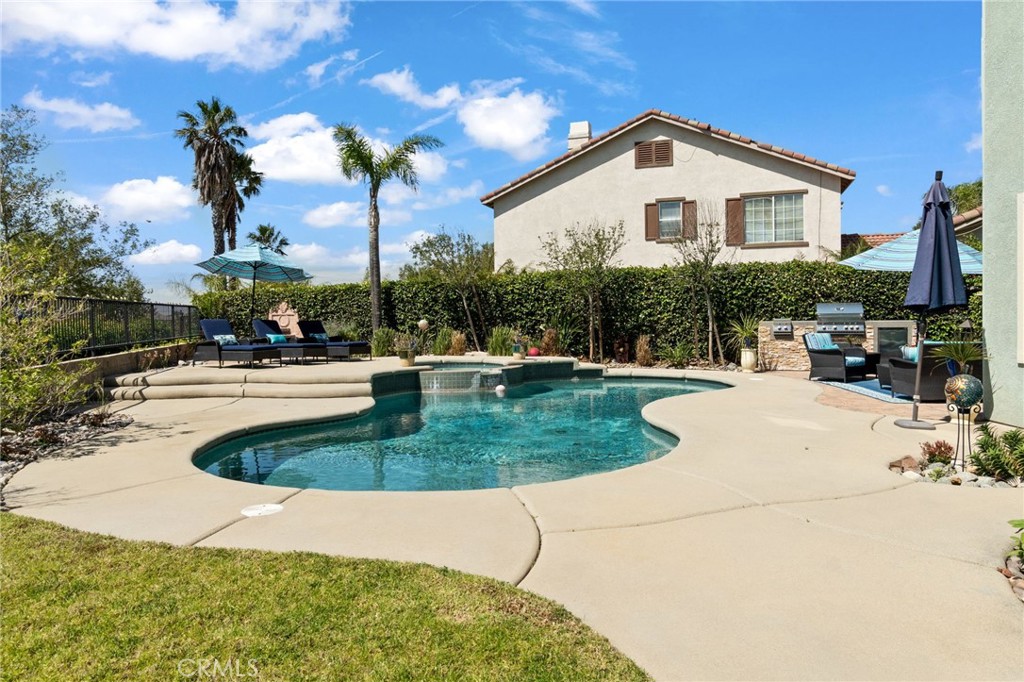 13939 Guidera Drive Rancho Cucamonga, CA 91739 - Photo 42 of 46 a swimming pool with outdoor seating and yard