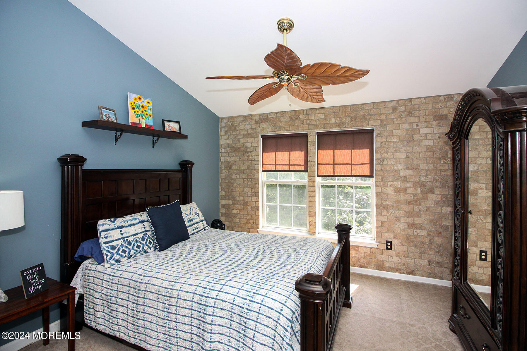 19 Saxton Road, Unit 58 Farmingdale, NJ 07727 - Photo 16 of 31 a bedroom with a bed and a chandelier