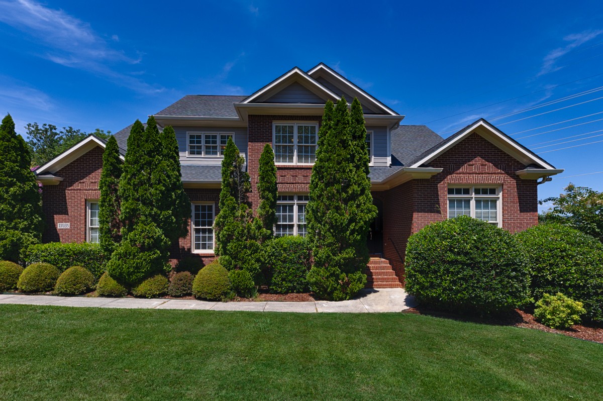 11035 Mathis Mountain Road Southeast Huntsville, AL 35803 - Photo 1 of 40 a front view of a house with a yard