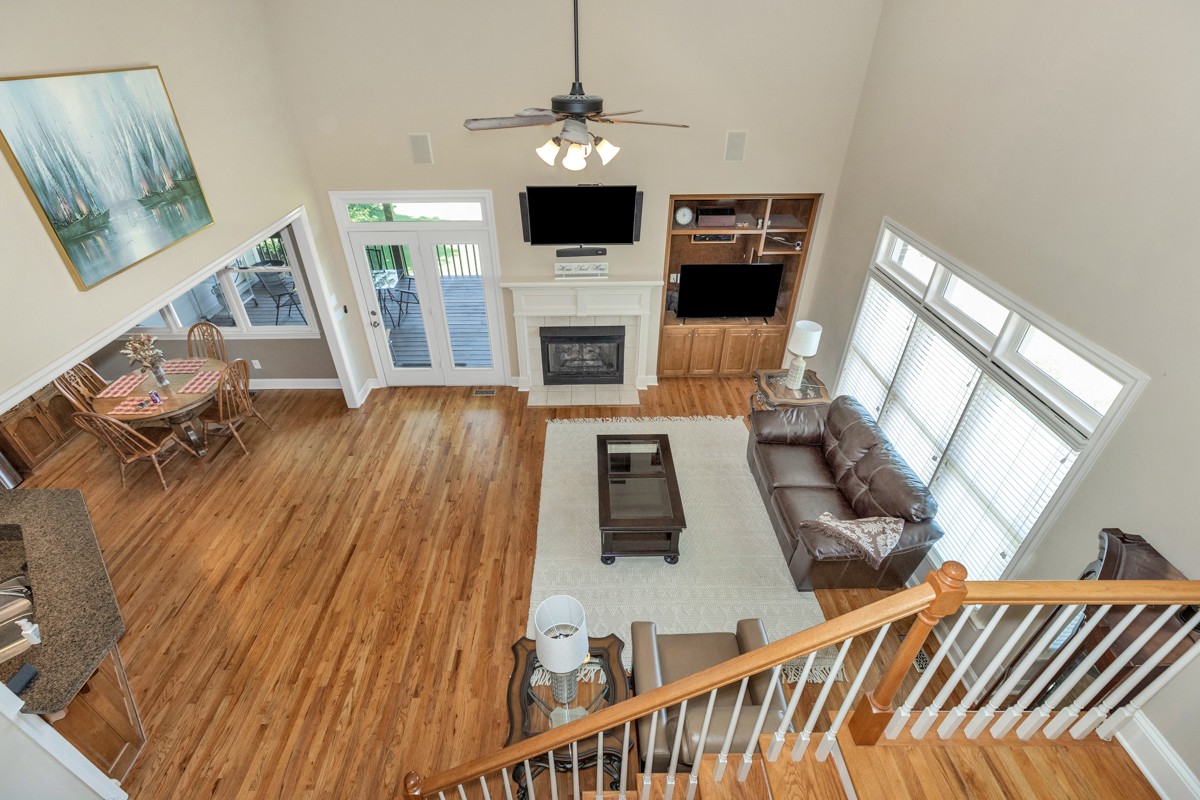 11035 Mathis Mountain Road Southeast Huntsville, AL 35803 - Photo 11 of 40 a living room with furniture and a fireplace