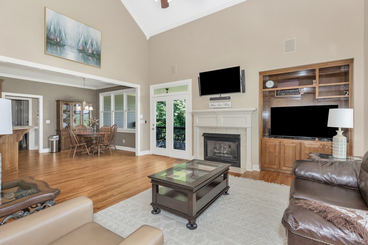 11035 Mathis Mountain Road Southeast Huntsville, AL 35803 - Photo 21 of 40 a living room with furniture a flat screen tv and a fireplace
