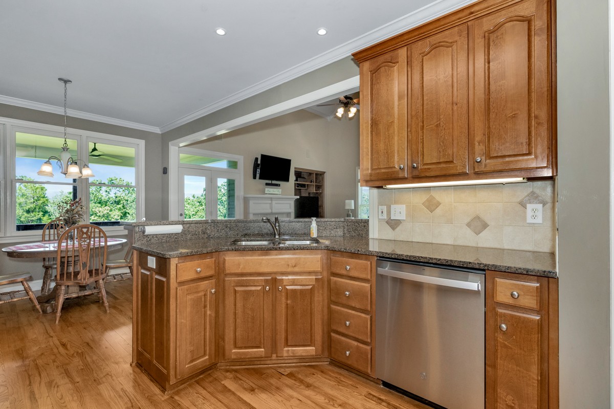 11035 Mathis Mountain Road Southeast Huntsville, AL 35803 - Photo 38 of 40 a kitchen with a sink and cabinets
