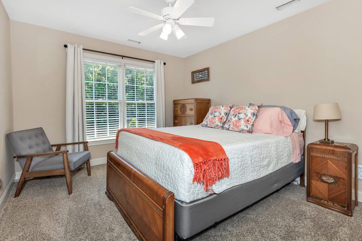 11035 Mathis Mountain Road Southeast Huntsville, AL 35803 - Photo 5 of 40 a bed sitting in a bedroom next to a window