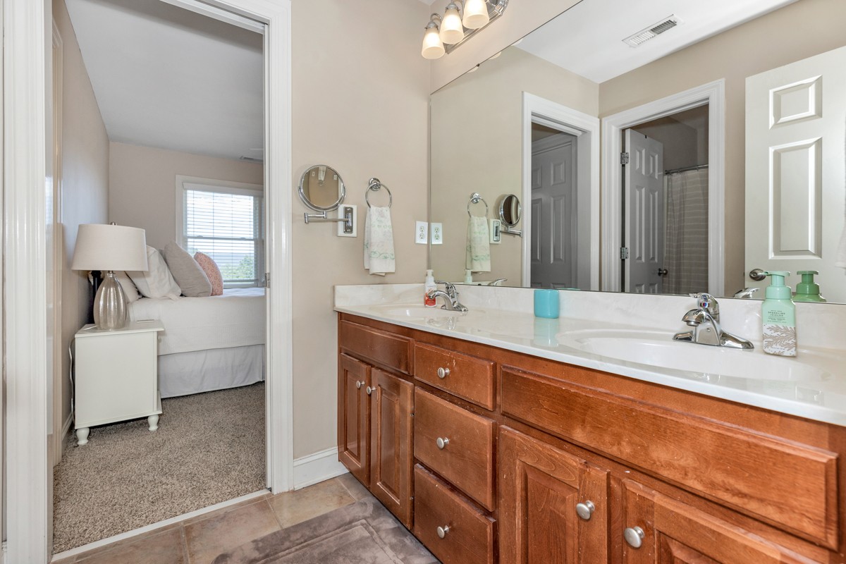 11035 Mathis Mountain Road Southeast Huntsville, AL 35803 - Photo 10 of 40 a spacious bathroom with a double vanity sink double and mirror
