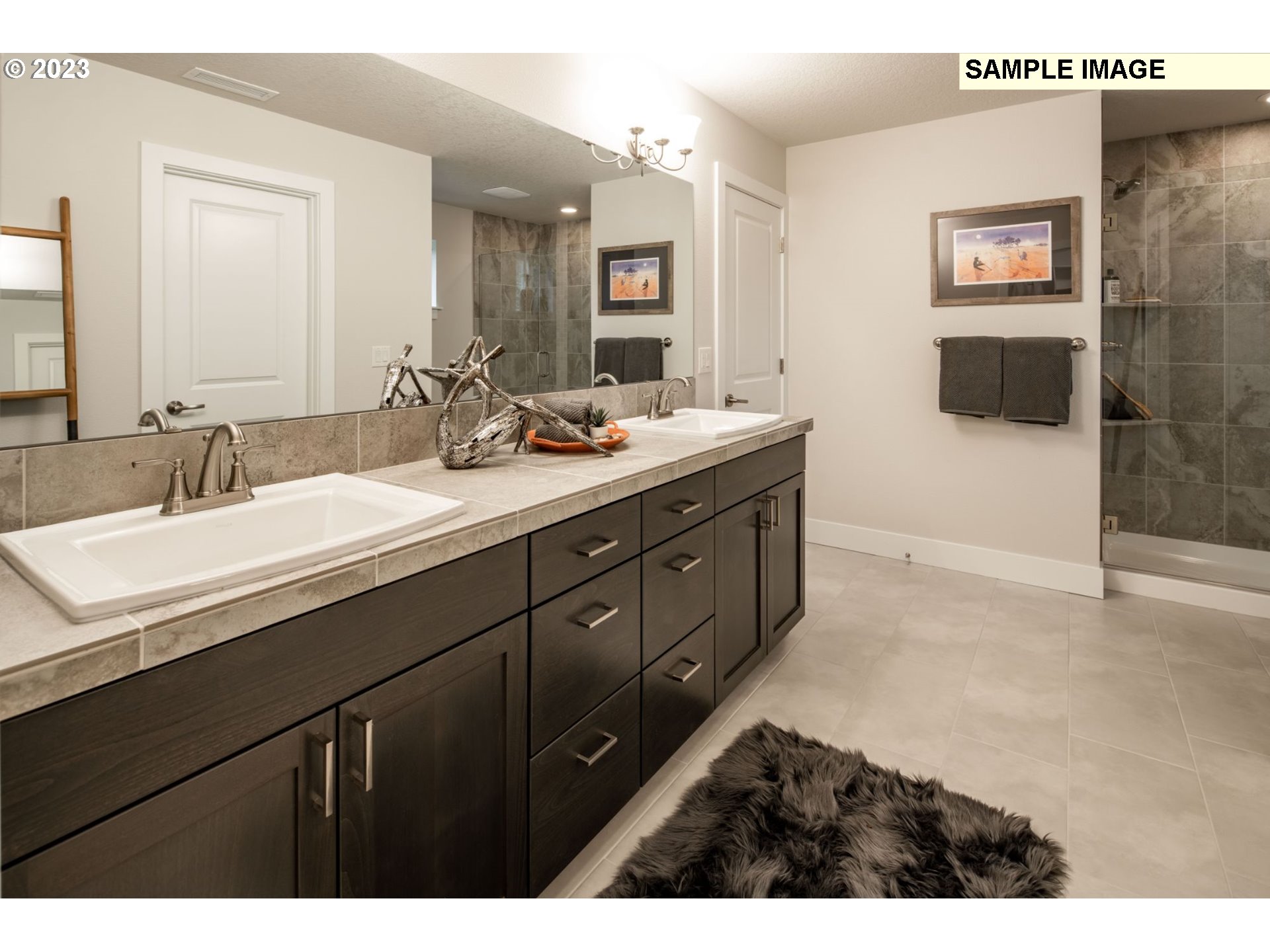 730 Northwest 178th Street Ridgefield, WA 98642 - Photo 14 of 21 a bathroom with a double vanity sink and mirror