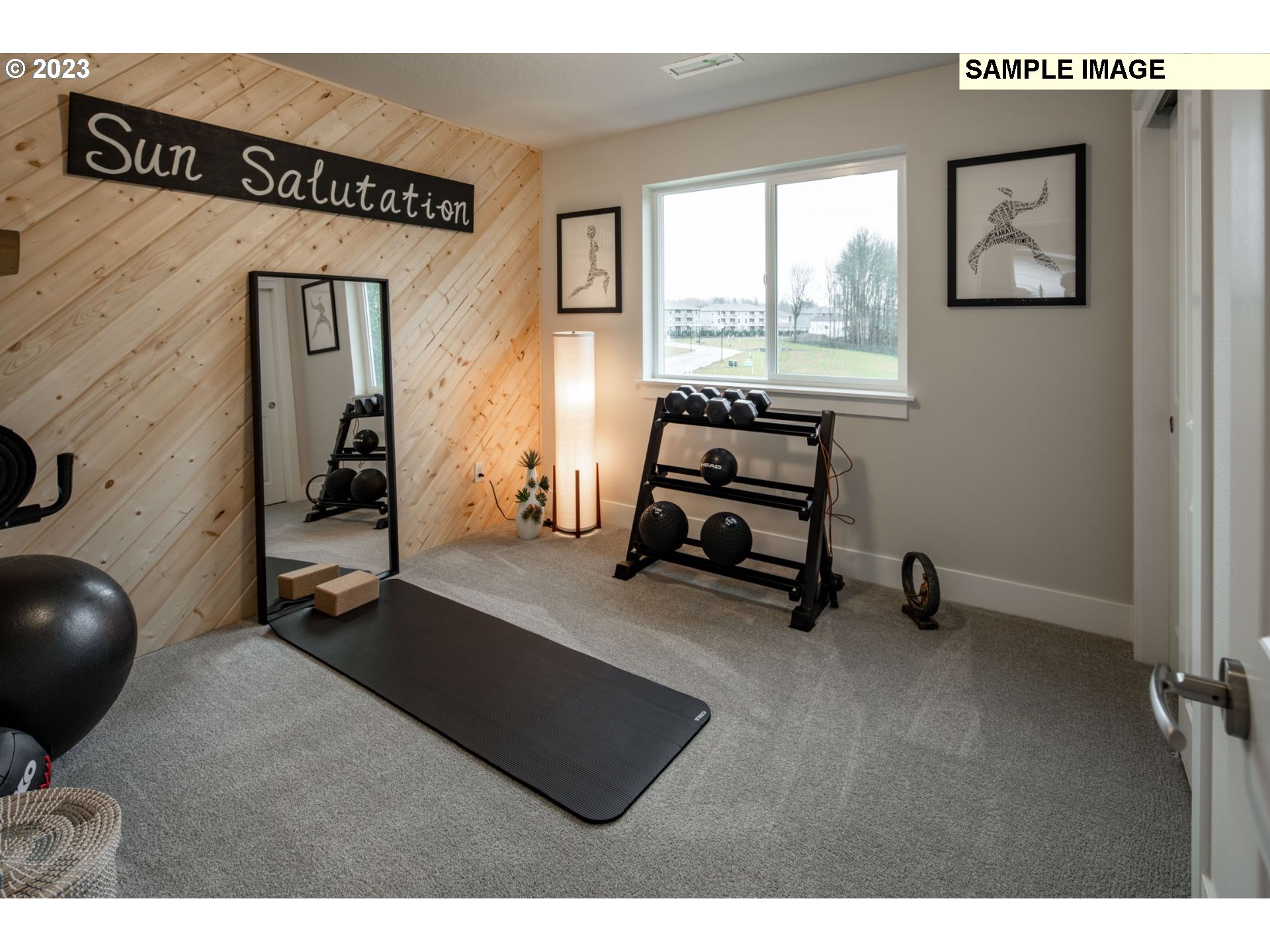 730 Northwest 178th Street Ridgefield, WA 98642 - Photo 17 of 21 a room with gym equipment and a large window