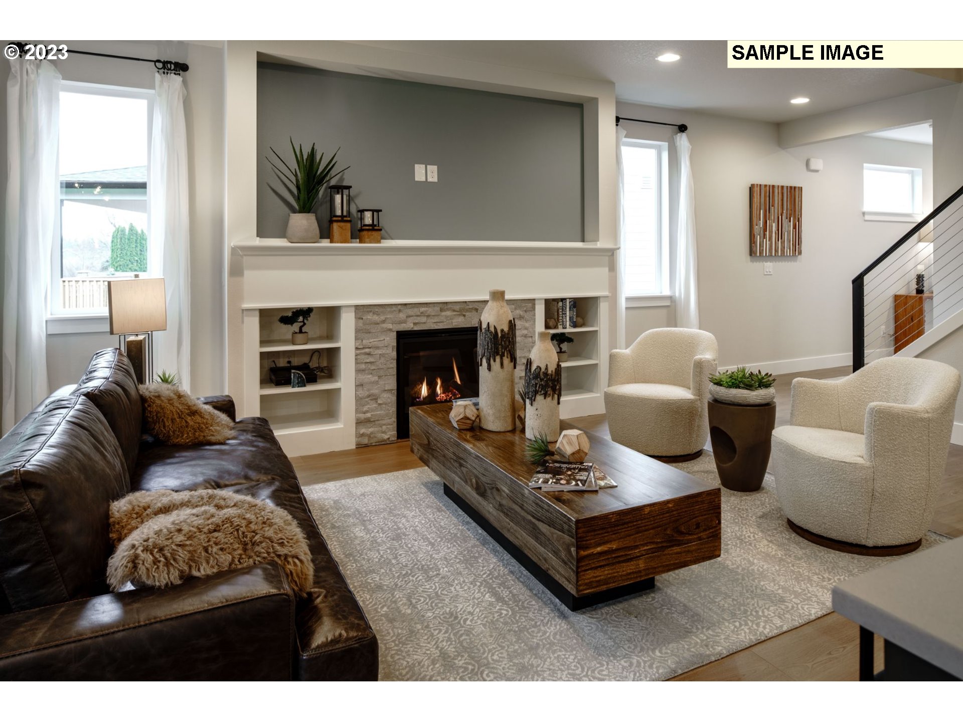 730 Northwest 178th Street Ridgefield, WA 98642 - Photo 8 of 21 a living room with furniture and a fireplace