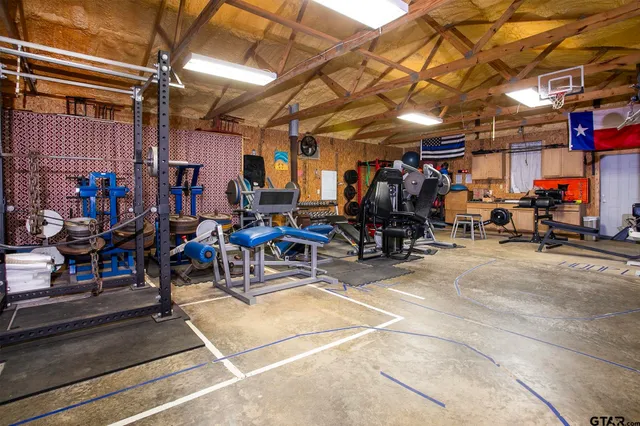 a view of a porch with a table and chairs and potted plants