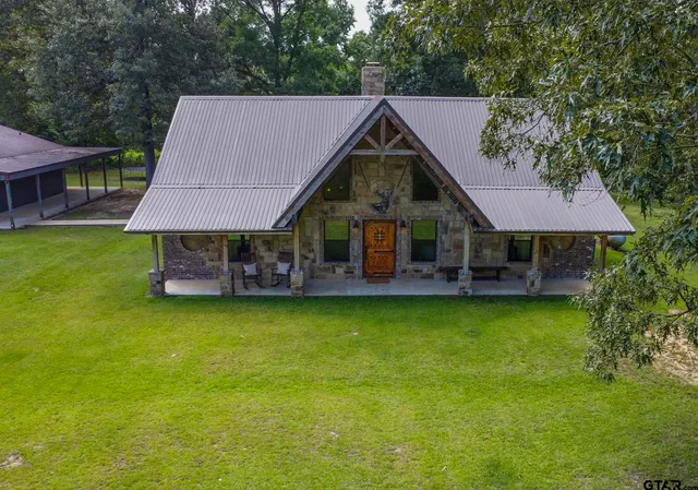 a view of front door with outdoor seating