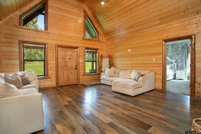 a view of a livingroom with a fireplace and furniture