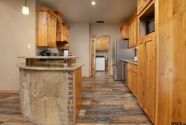 a spacious bedroom with a bed and a window